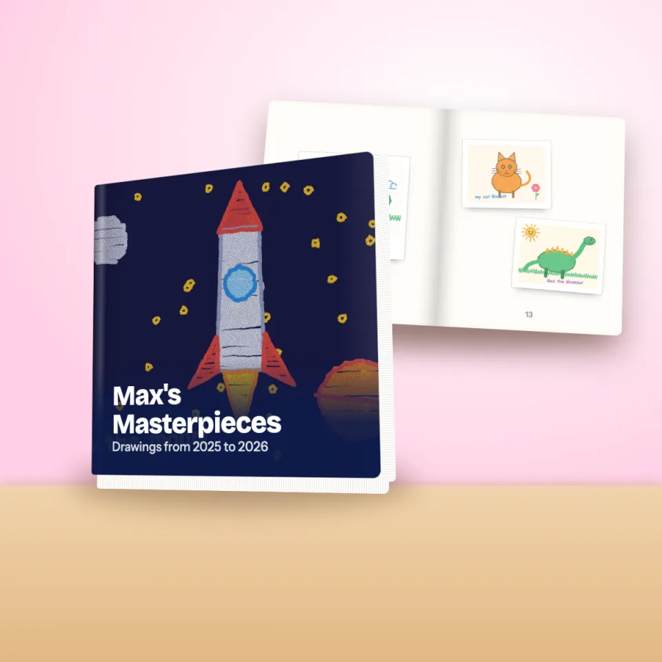 A hardcover children's artwork book with a rocket drawing on the cover, next to an open page spread of framed drawings