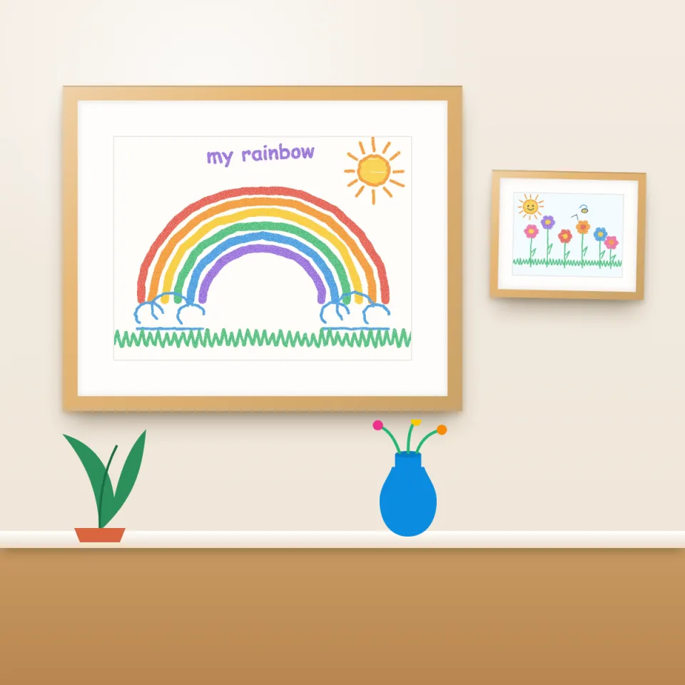 A child's rainbow drawing printed on archival paper and hung in a wooden frame on a living room wall